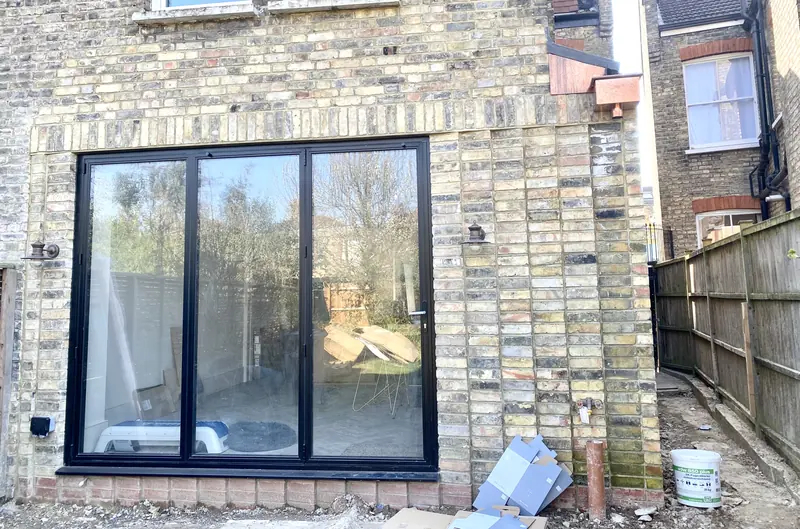 Rear Extension — Steel Beams, Matched Brickwork & Glass Roof.