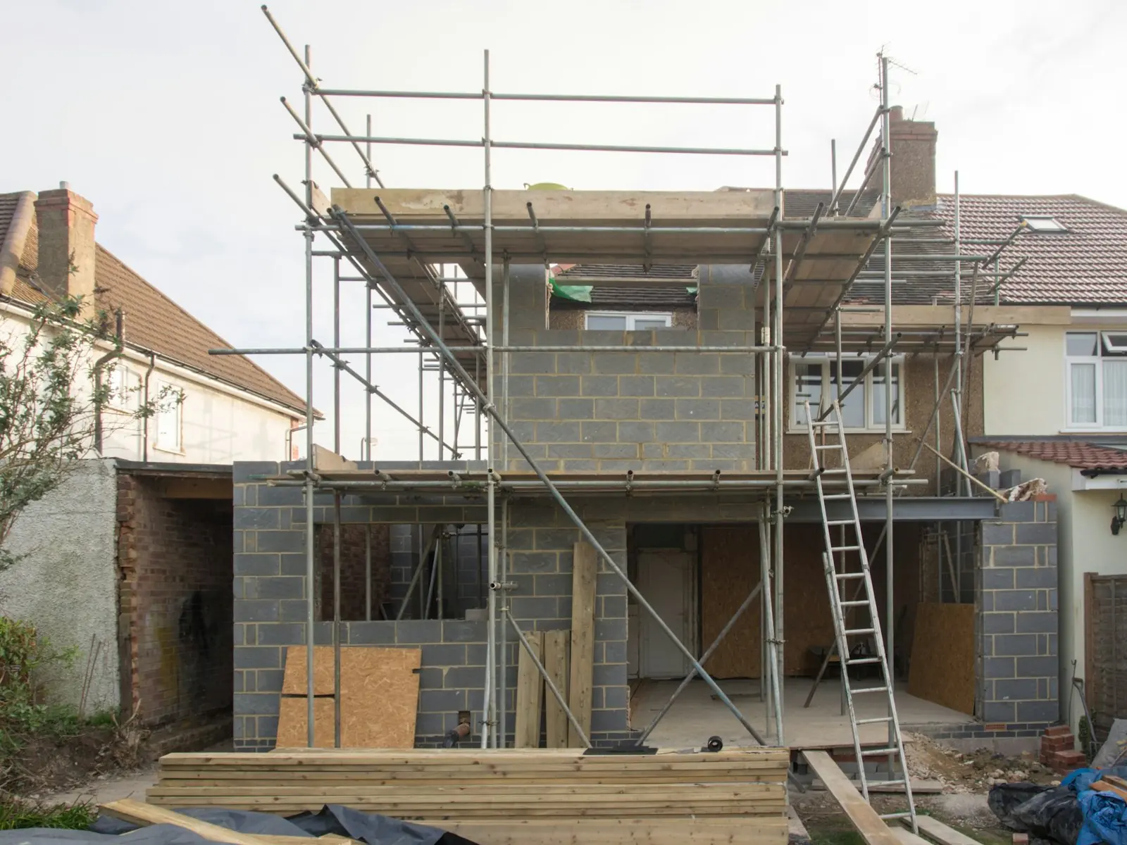 A scaffolded London home part-way through a two-storey extension