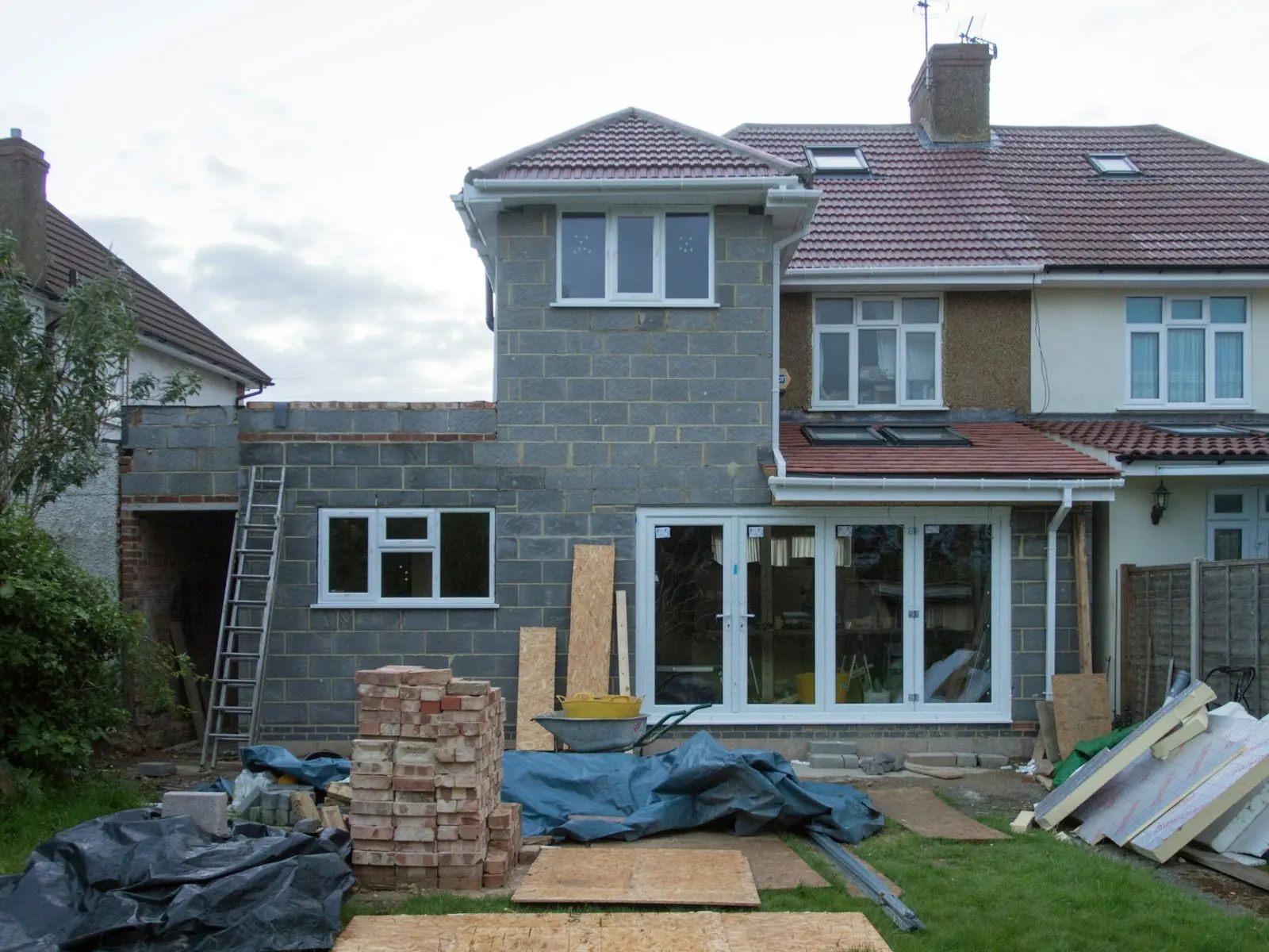 A completed single-storey rear extension with bi-fold doors onto the garden